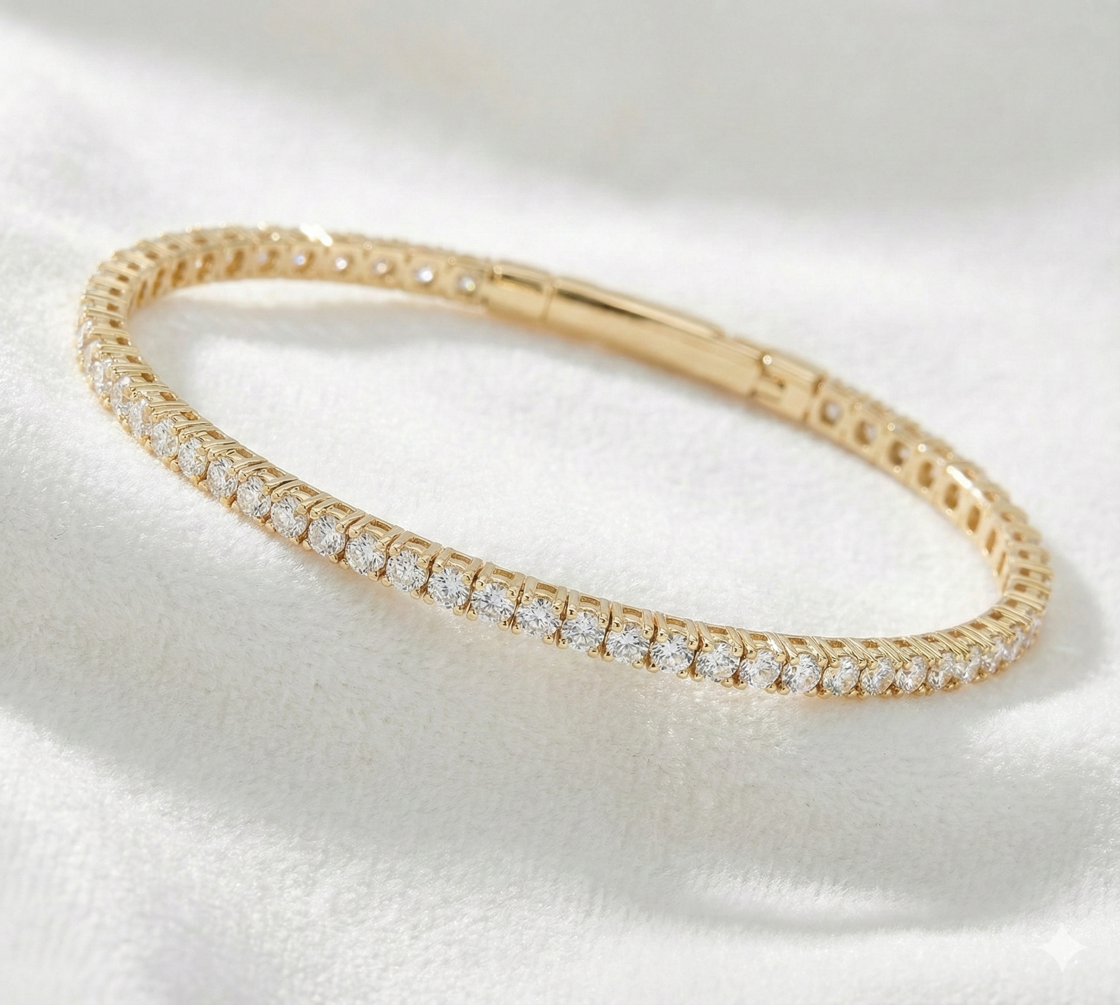 Gold bracelet with diamonds on a white background