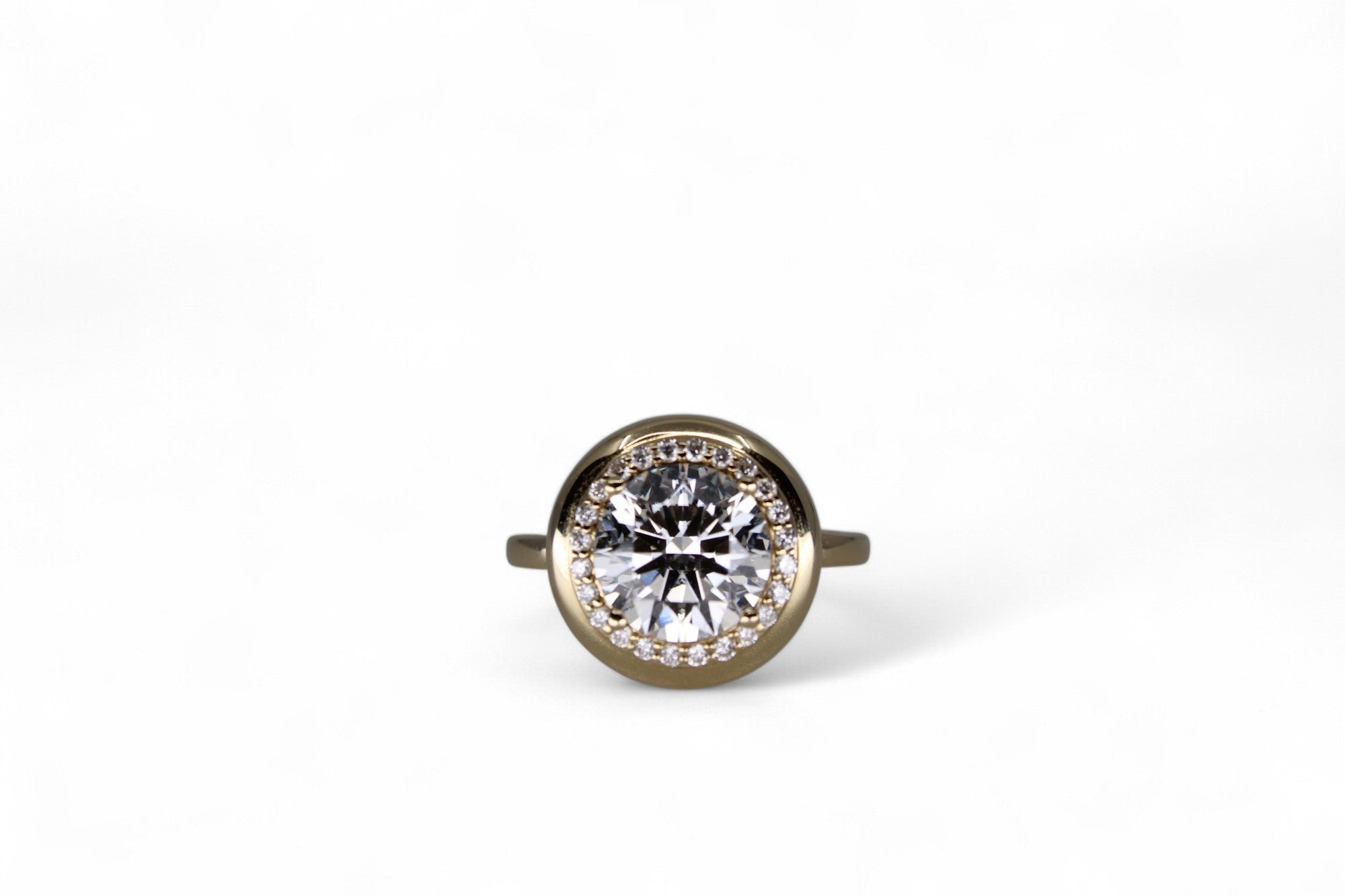 3 carat diamond halo ring in gold bezel - Jewelry by Cleo