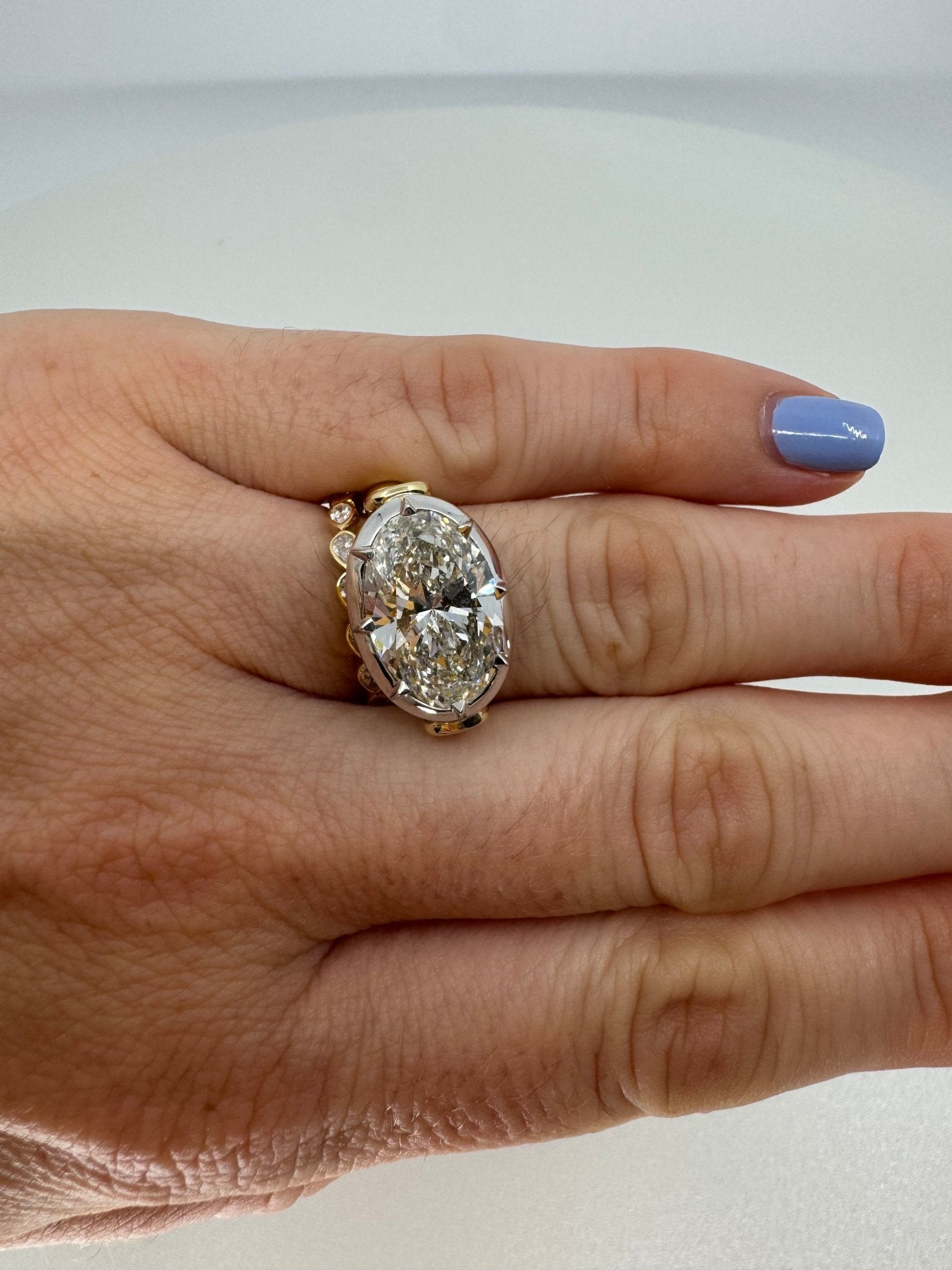7 carat oval lab grown diamond engagement ring set in two tone collet - Jewelry by Cleo
