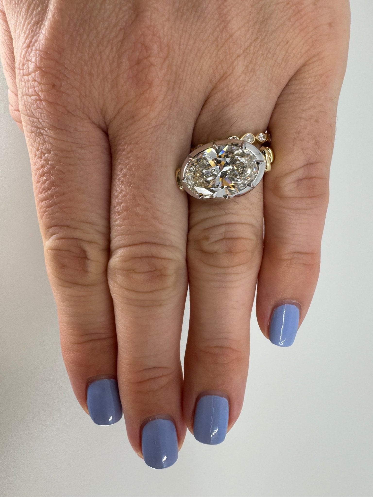 7 carat oval lab grown diamond engagement ring set in two tone collet - Jewelry by Cleo