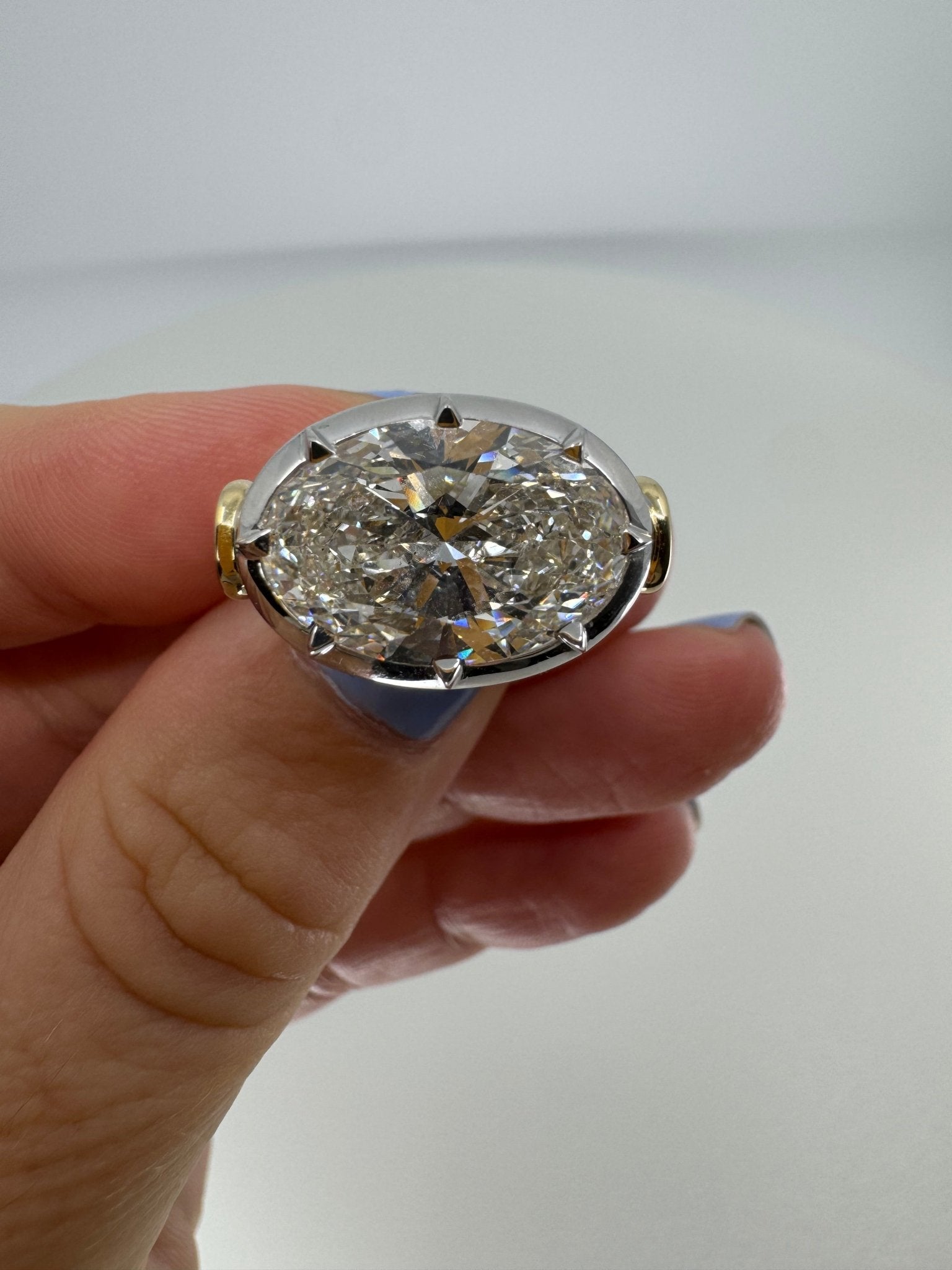 7 carat oval lab grown diamond engagement ring set in two tone collet - Jewelry by Cleo