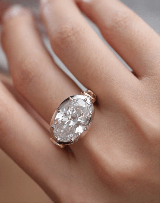 7 carat oval lab grown diamond engagement ring set in two tone collet - Jewelry by Cleo