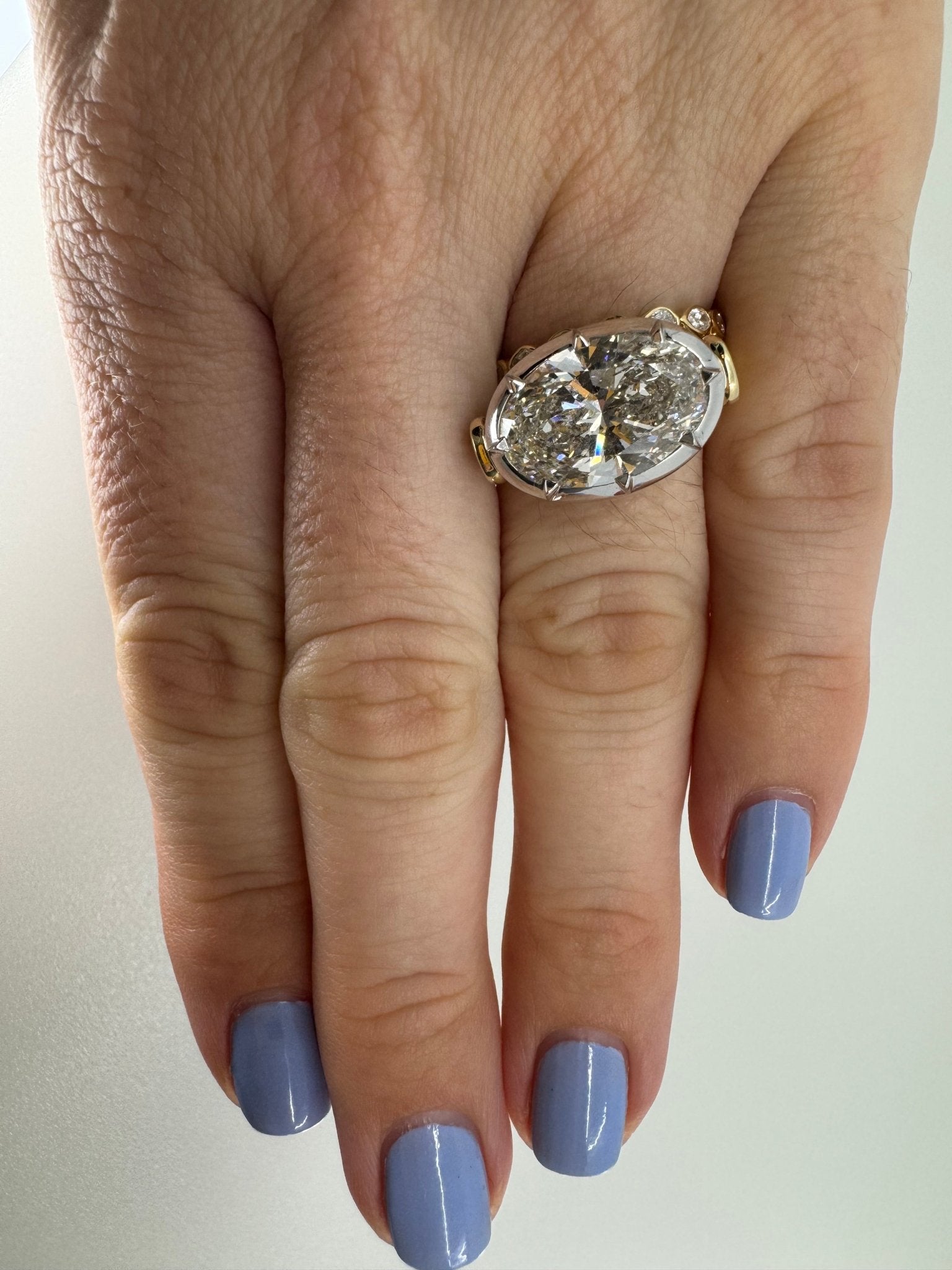 7 carat oval lab grown diamond engagement ring set in two tone collet - Jewelry by Cleo