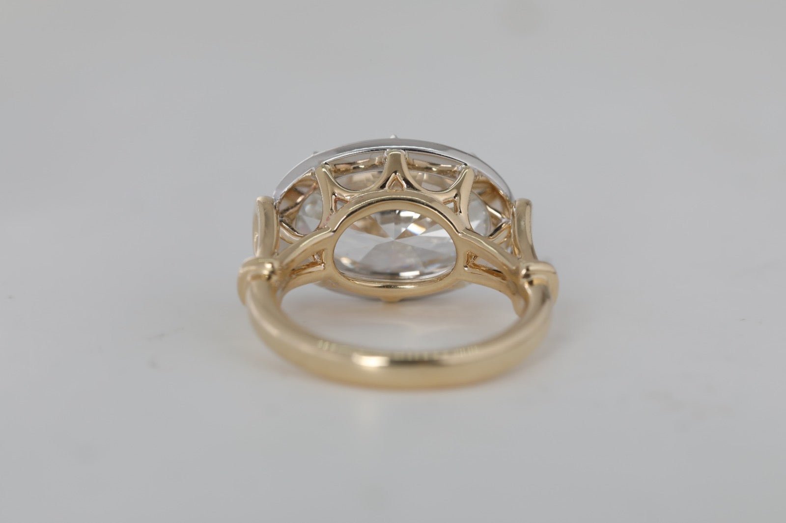 7 carat oval lab grown diamond engagement ring set in two tone collet - Jewelry by Cleo
