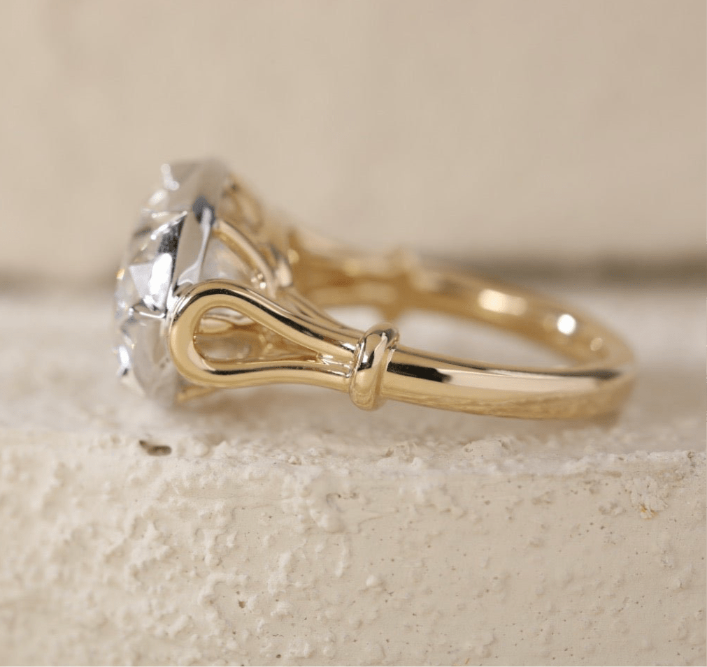 7 carat oval lab grown diamond engagement ring set in two tone collet - Jewelry by Cleo