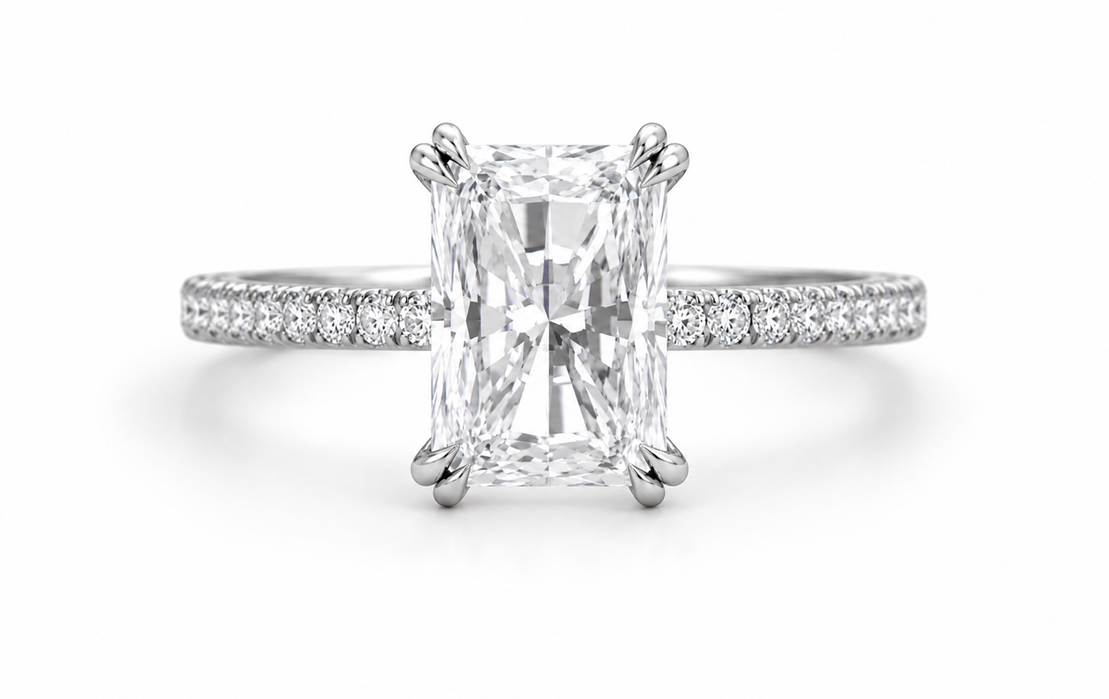An emerald-cut diamond engagement ring with a silver-toned band paved with small diamonds, shown on a clean white background.