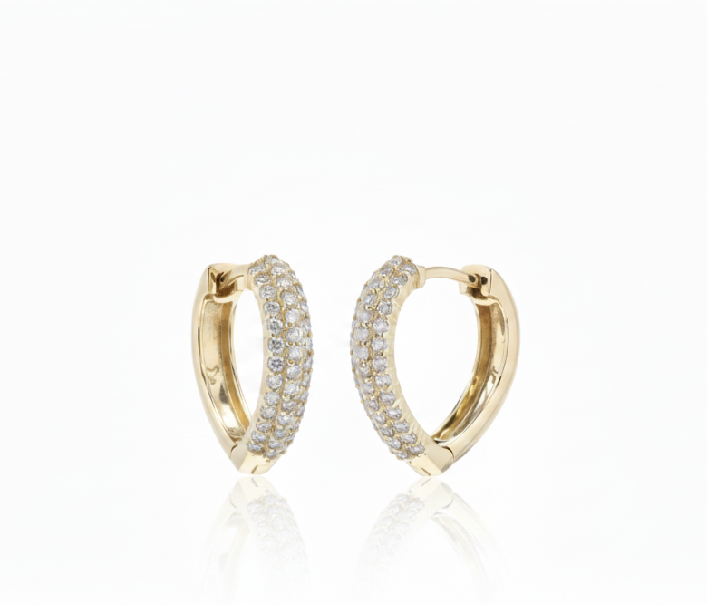 Gold hoop earrings with embedded diamonds on a white background