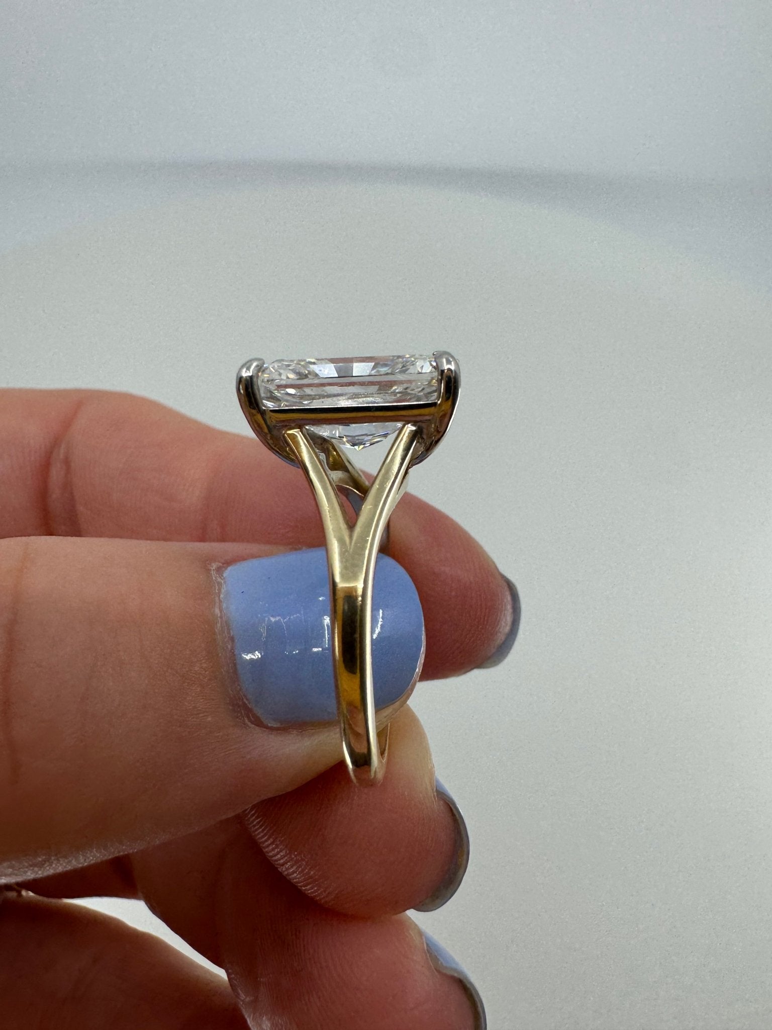 Two tone slight split shank solitaire engagement ring featuring a 5 carat radiant center stone - Jewelry by Cleo