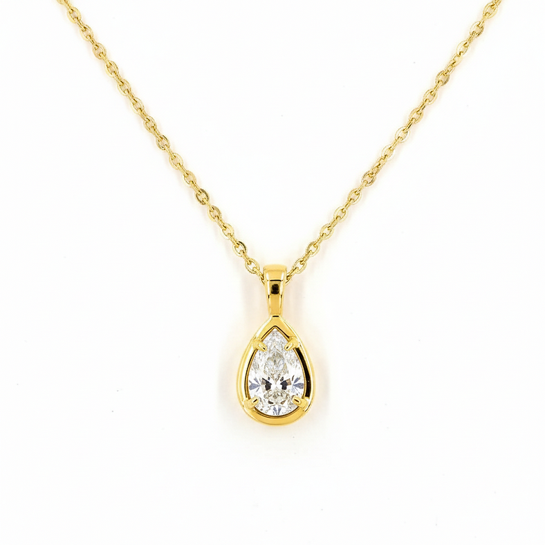 Gold necklace with a teardrop-shaped diamond pendant on a white background