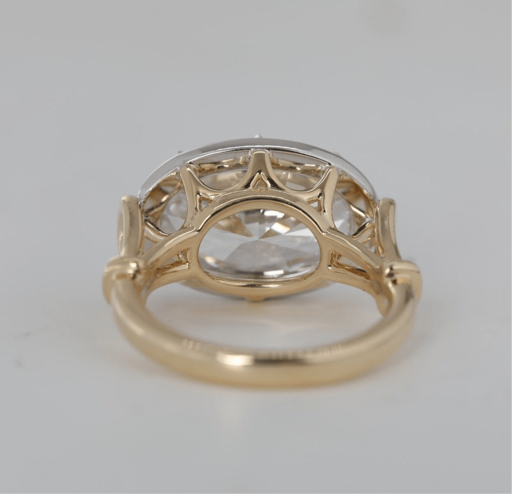 7 carat oval lab grown diamond engagement ring set in two tone collet - Jewelry by Cleo