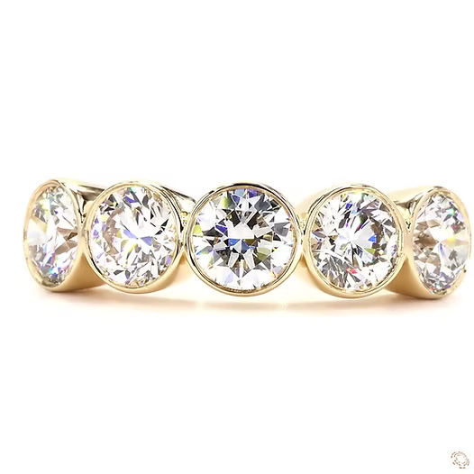 Five diamond stud earrings on a white background