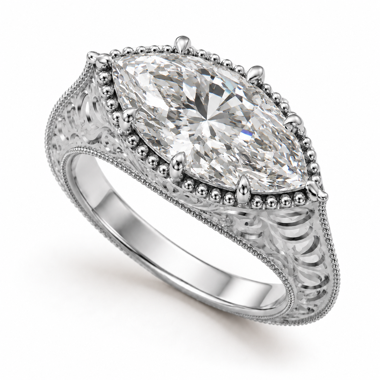 A silver-toned diamond ring featuring a large marquise-cut center stone in a prong setting, surrounded by a beaded border and an ornate filigree band, shown on a white background.