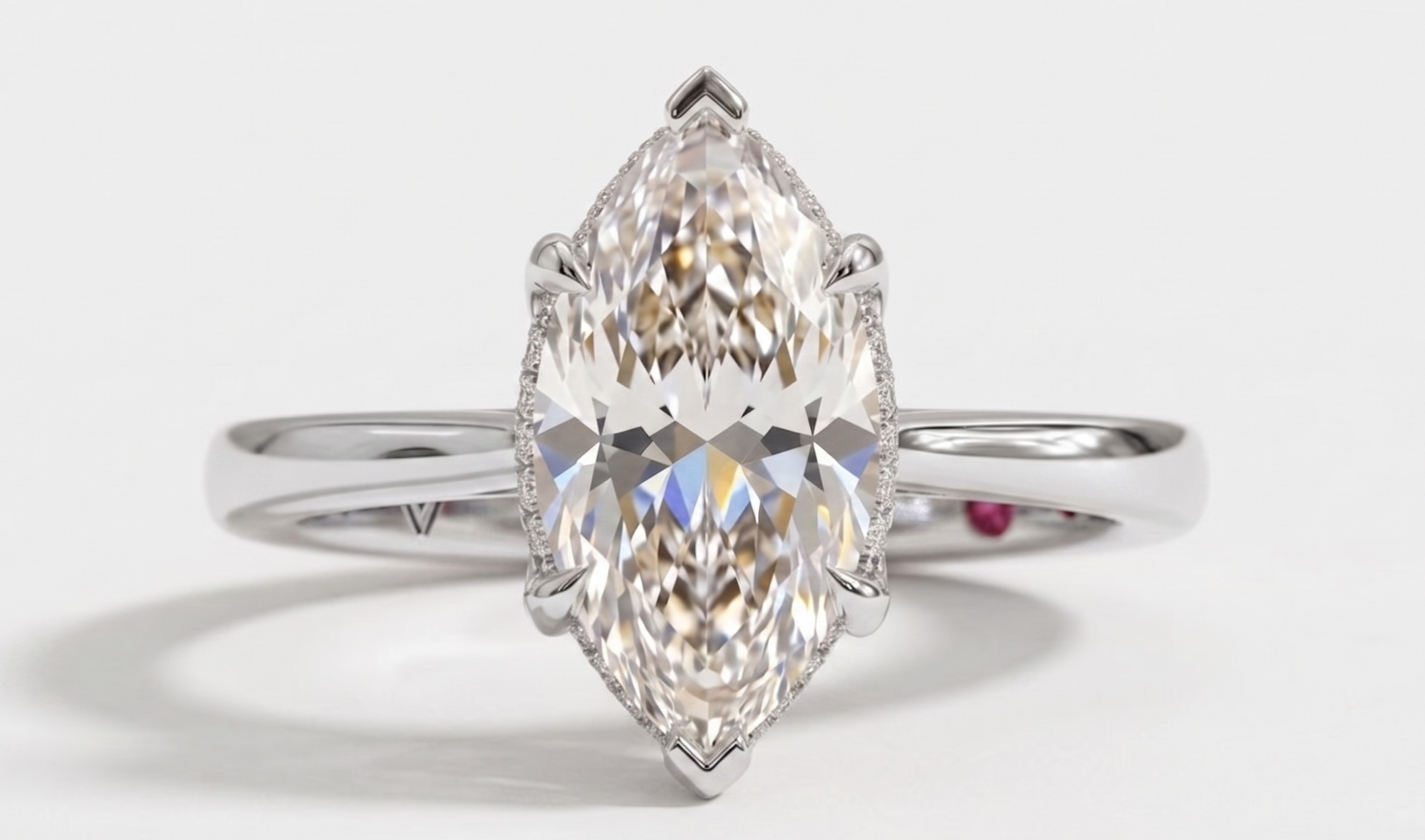 A marquise-cut diamond ring with a silver-toned band, photographed on a clean white background.