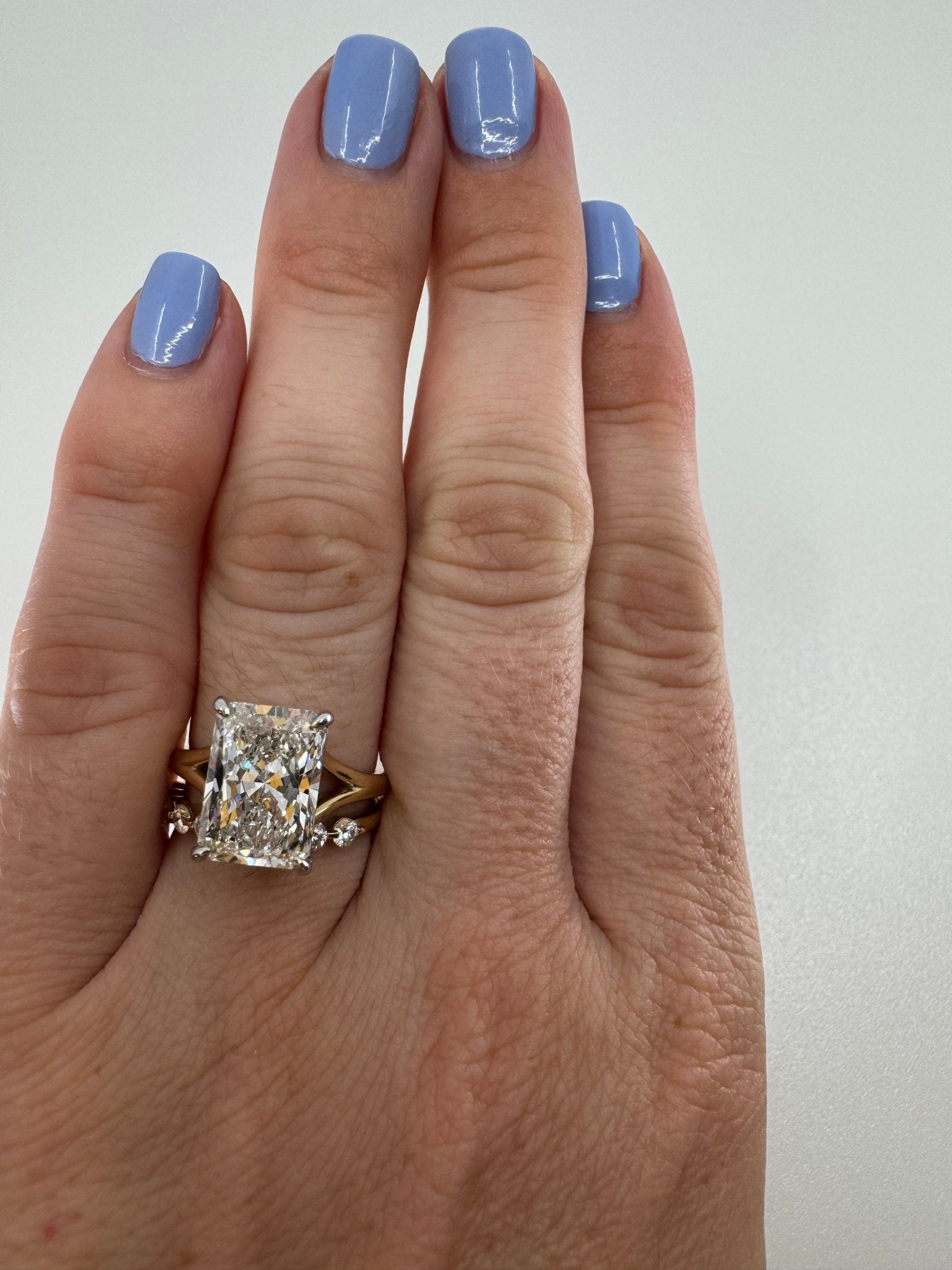 Two tone slight split shank solitaire engagement ring featuring a 5 carat radiant center stone - Jewelry by Cleo